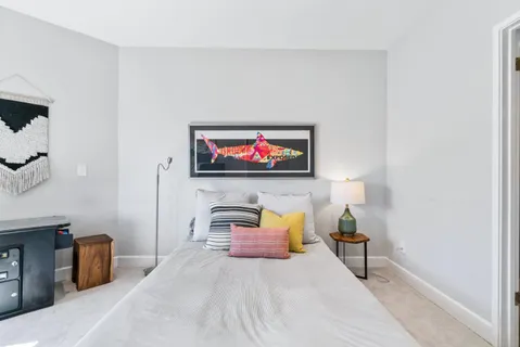 a bedroom with a bed and a couch