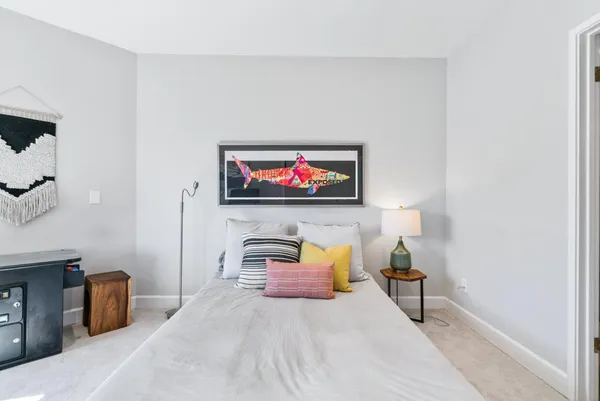 a bedroom with a bed and a couch