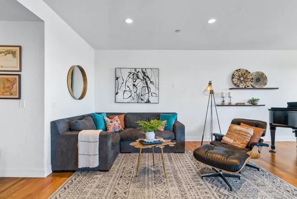 a living room with furniture and a rug