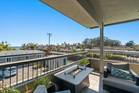 a view of a balcony with chairs