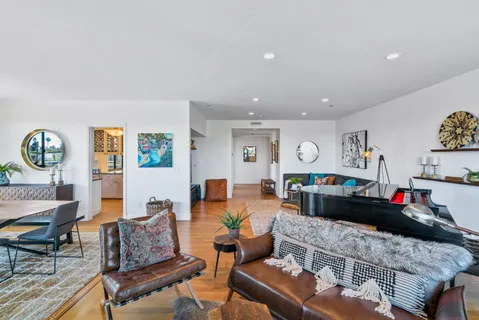 a living room with furniture and a table