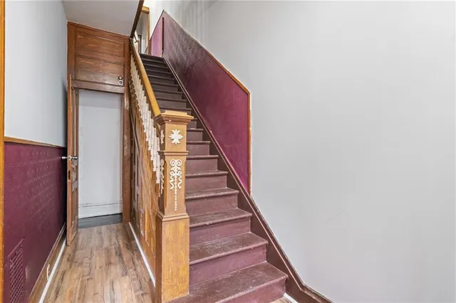 a view of an empty room with stairs