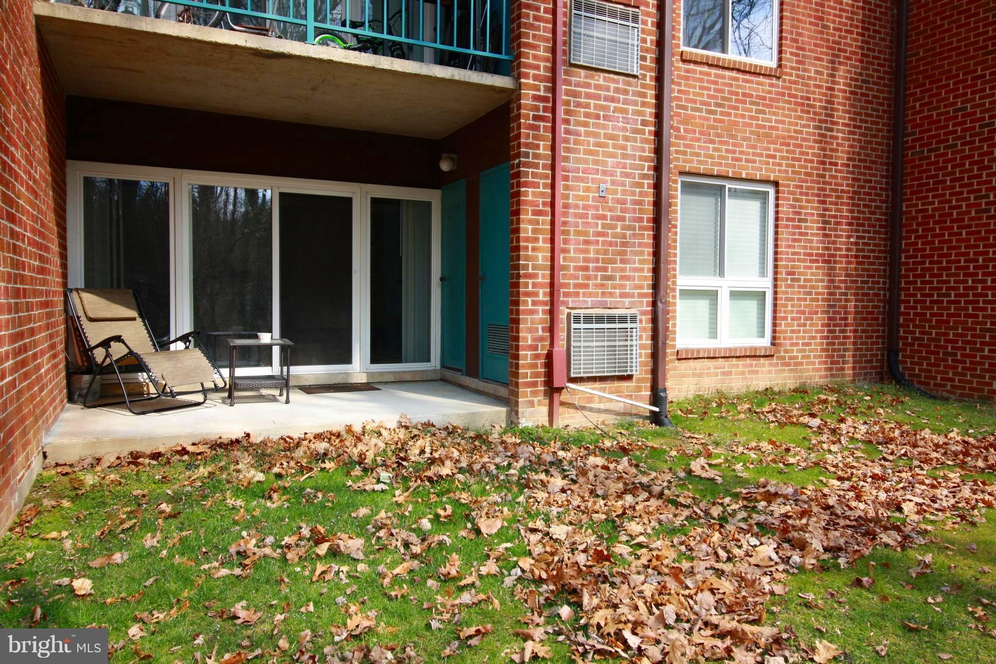 11833 Shire Court, Unit 1A Reston, VA 20191 - Photo 22 of 24 Exterior (Rear)Walk Patio with Storage