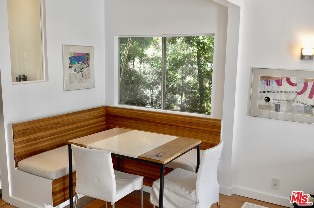 8521 Ridpath Drive Los Angeles, CA 90046 - Photo 5 of 14 a view of a dining room with furniture window and outside view