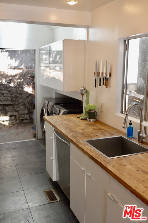 8521 Ridpath Drive Los Angeles, CA 90046 - Photo 7 of 14 a kitchen that has a sink and a stove