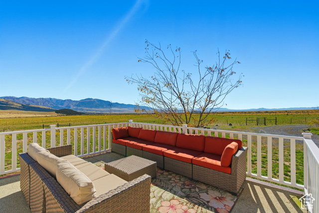 4768 East Hickman Canyon Road Stockton, UT 84071 - Photo 56 of 85 Deck featuring a view of countryside, a mountain view.