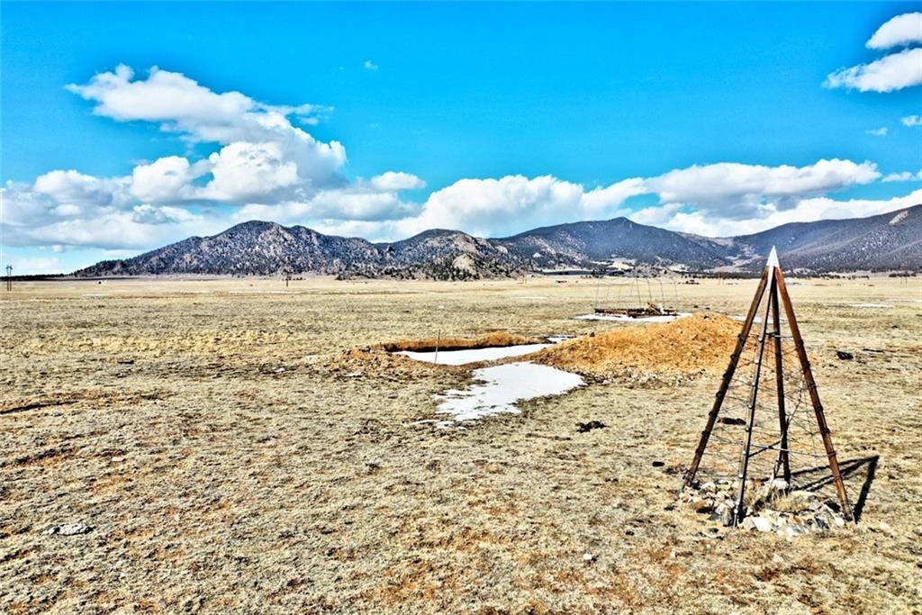 9251 Jackson Road Hartsel, CO 80449 - Photo 1 of 12 a view of an ocean with a mountain