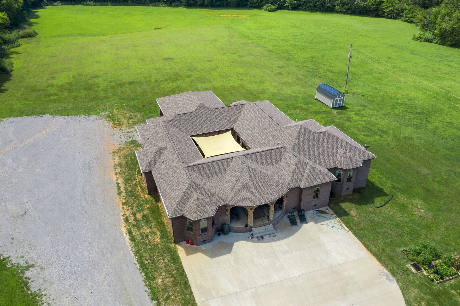 4785 Pulliam-Hardaway Road Springfield, TN 37172 - Photo 4 of 45 a view of a backyard with table and chairs potted plants and large tree