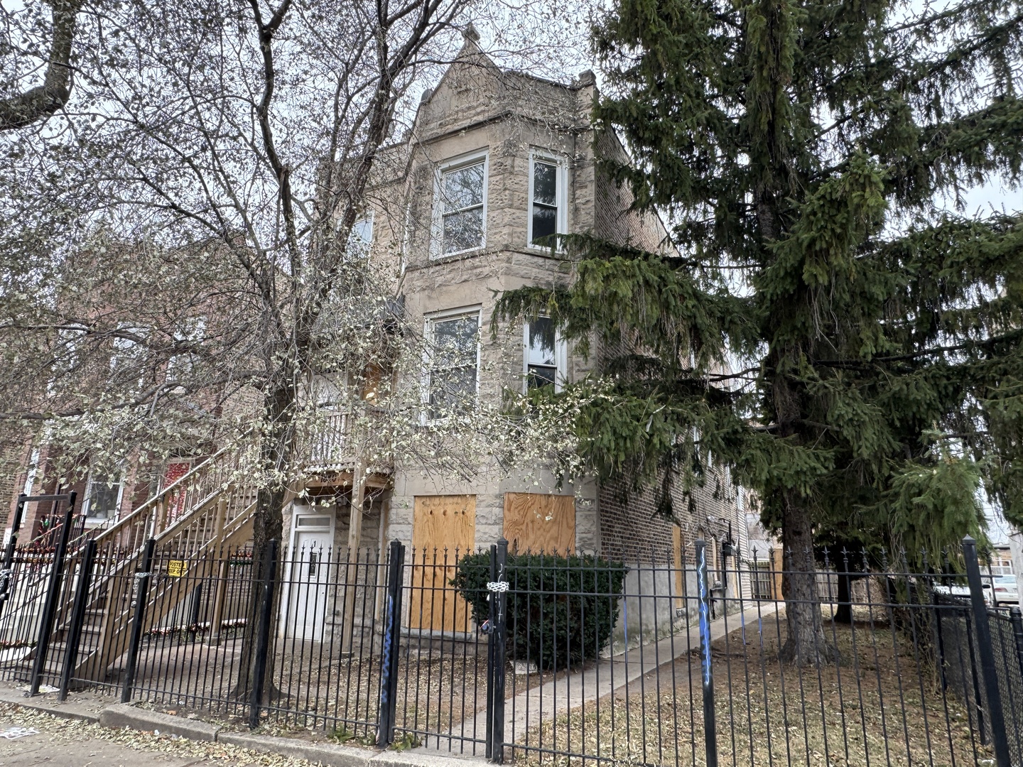 1840 South Harding Avenue Chicago, IL 60623 - Photo 1 of 15 a front view of a house with a tree