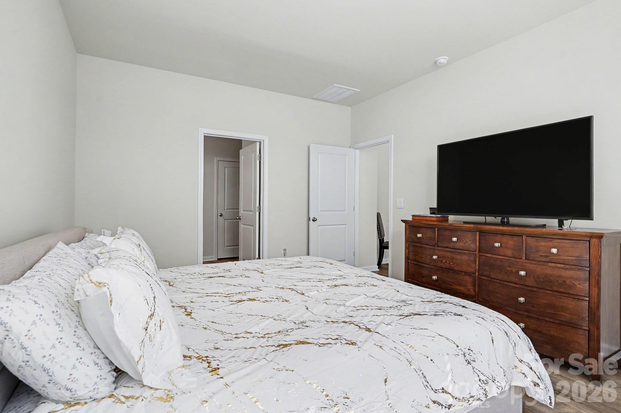 8093 Bear Claw Way Conway, SC 29526 - Photo 15 of 29 a bedroom with a bed and a flat screen tv
