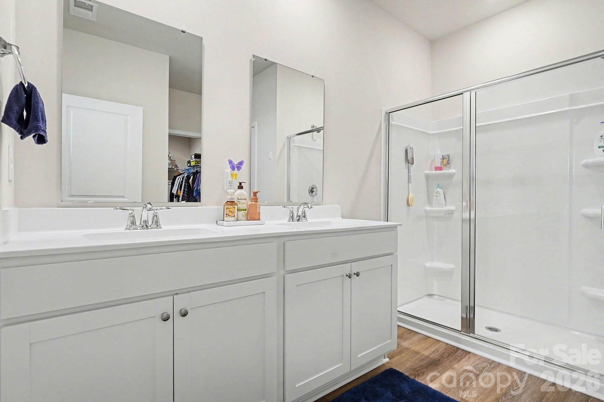 8093 Bear Claw Way Conway, SC 29526 - Photo 16 of 29 a bathroom with a double vanity sink mirror and shower