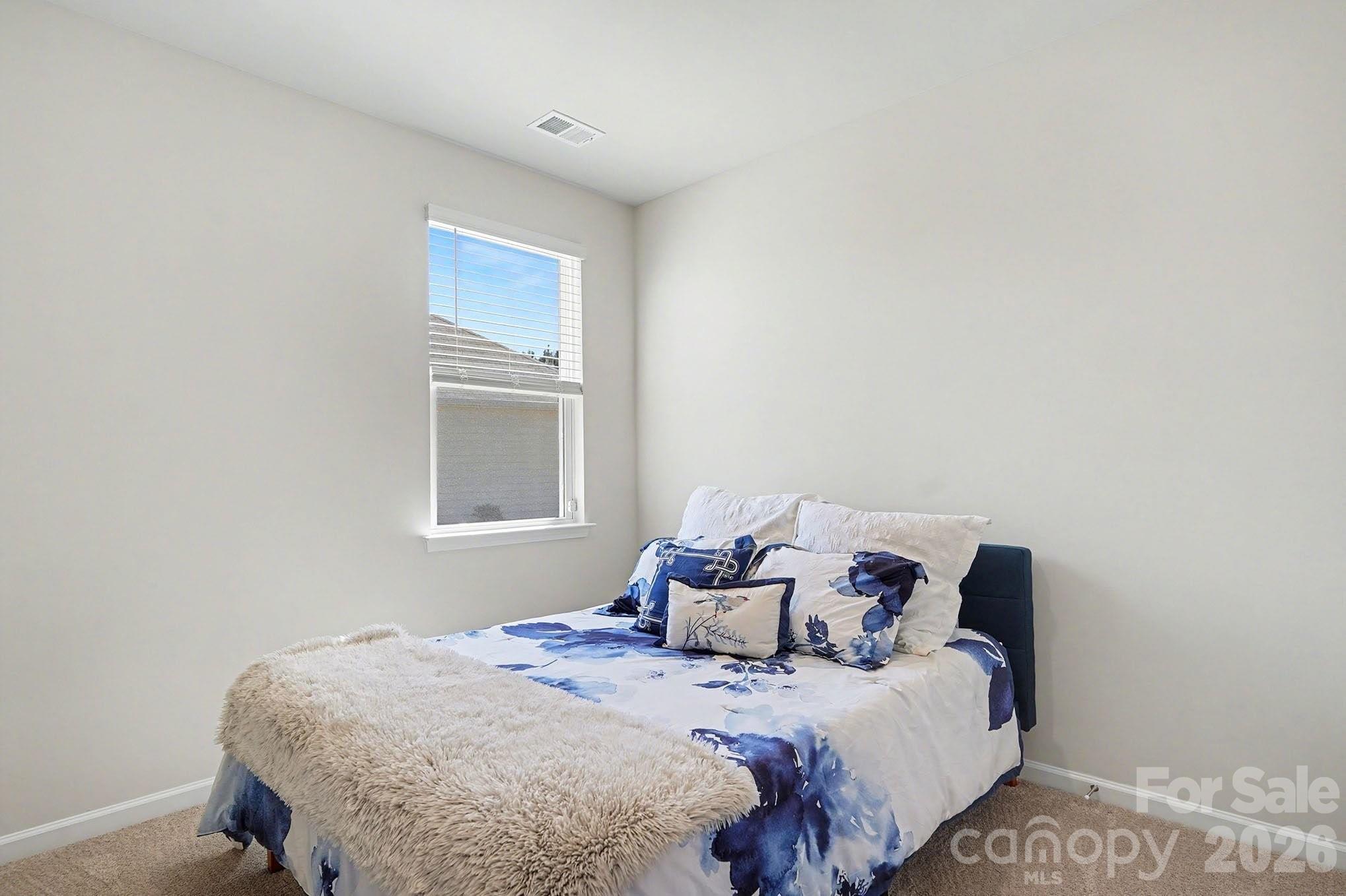 8093 Bear Claw Way Conway, SC 29526 - Photo 17 of 29 a bedroom with a bed and a window