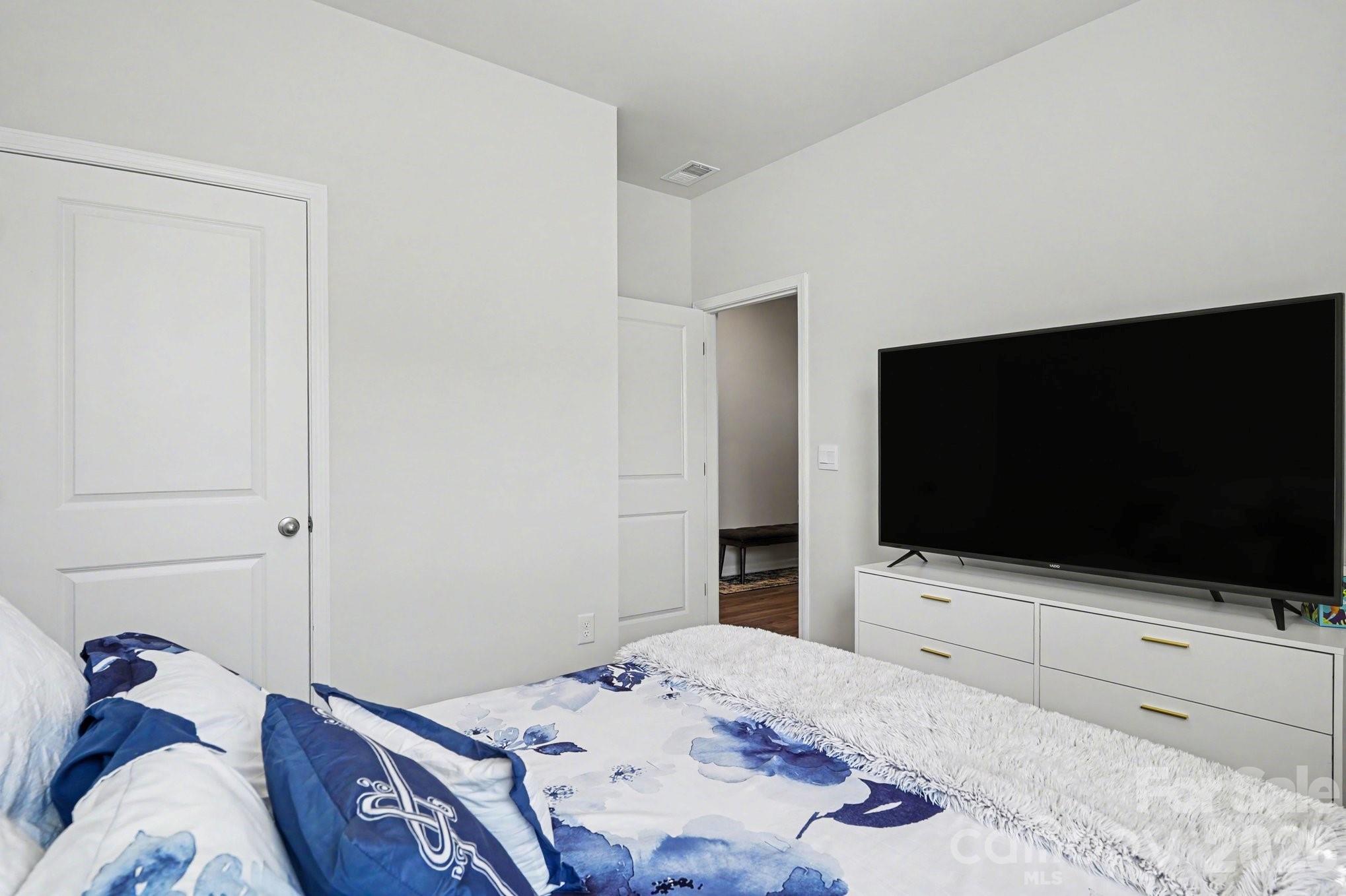 8093 Bear Claw Way Conway, SC 29526 - Photo 18 of 29 a bedroom with a bed and a flat screen tv
