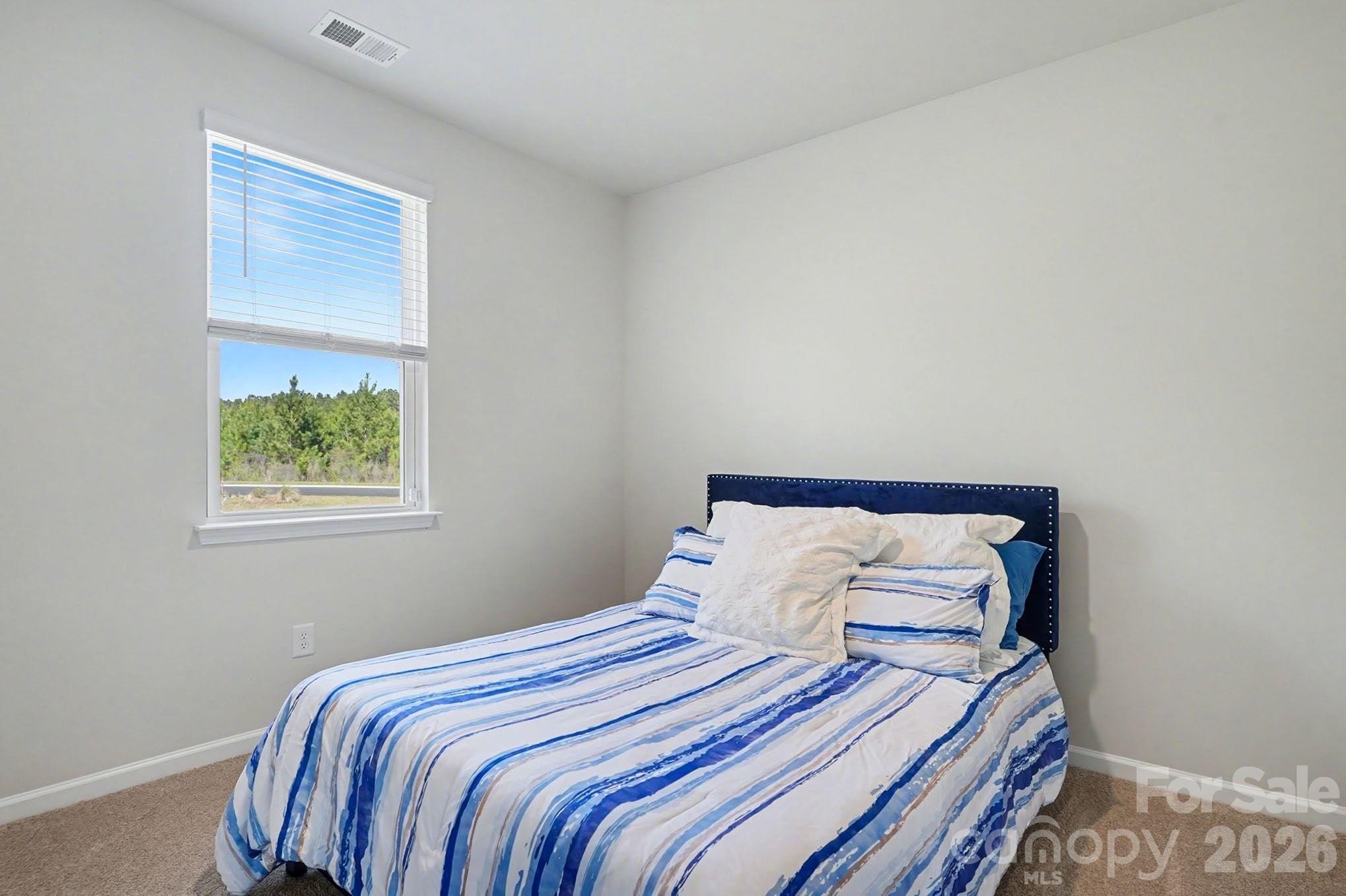 8093 Bear Claw Way Conway, SC 29526 - Photo 19 of 29 a bedroom with a bed and a window