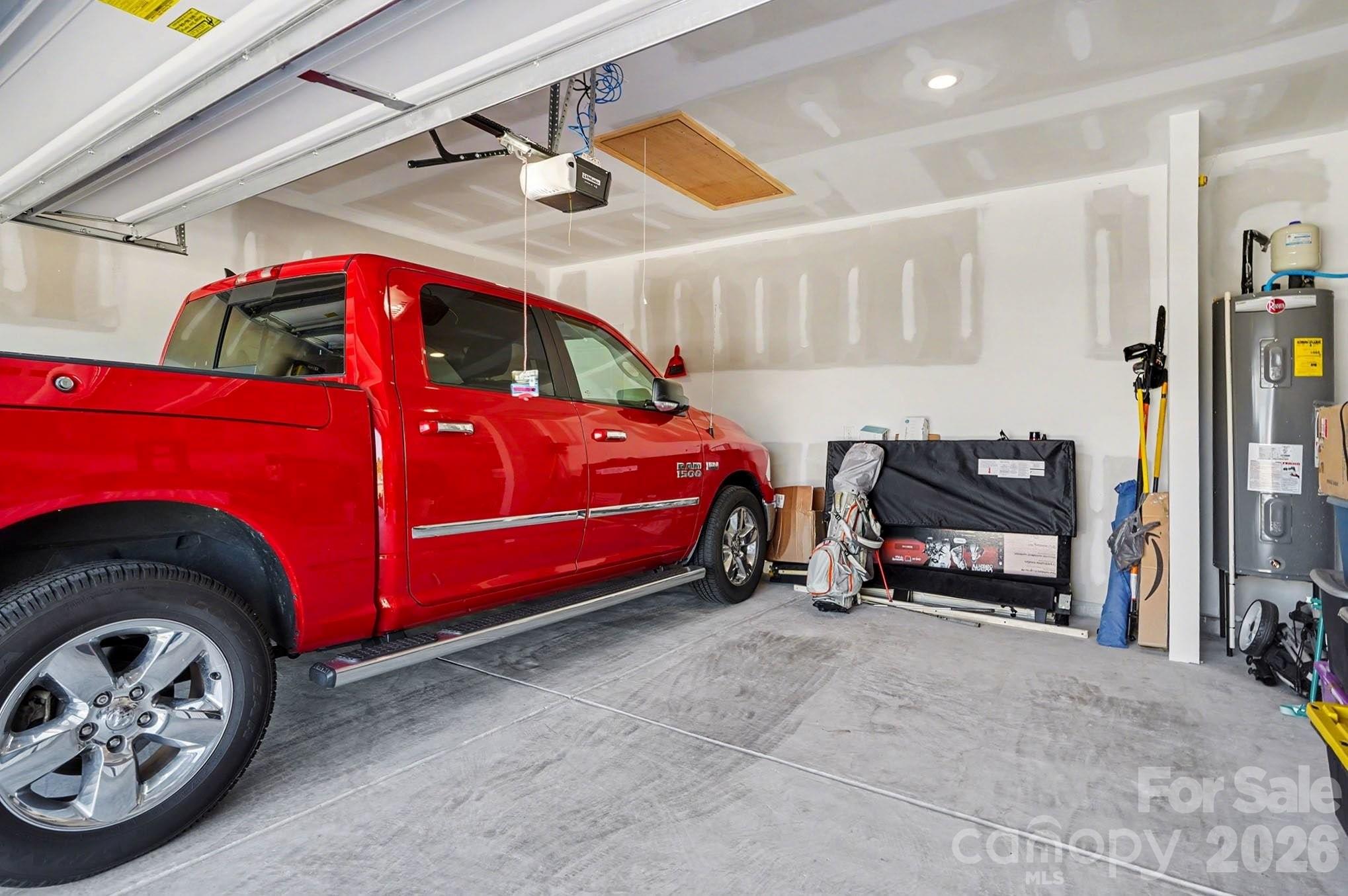 8093 Bear Claw Way Conway, SC 29526 - Photo 25 of 29 a blue car parked in a garage