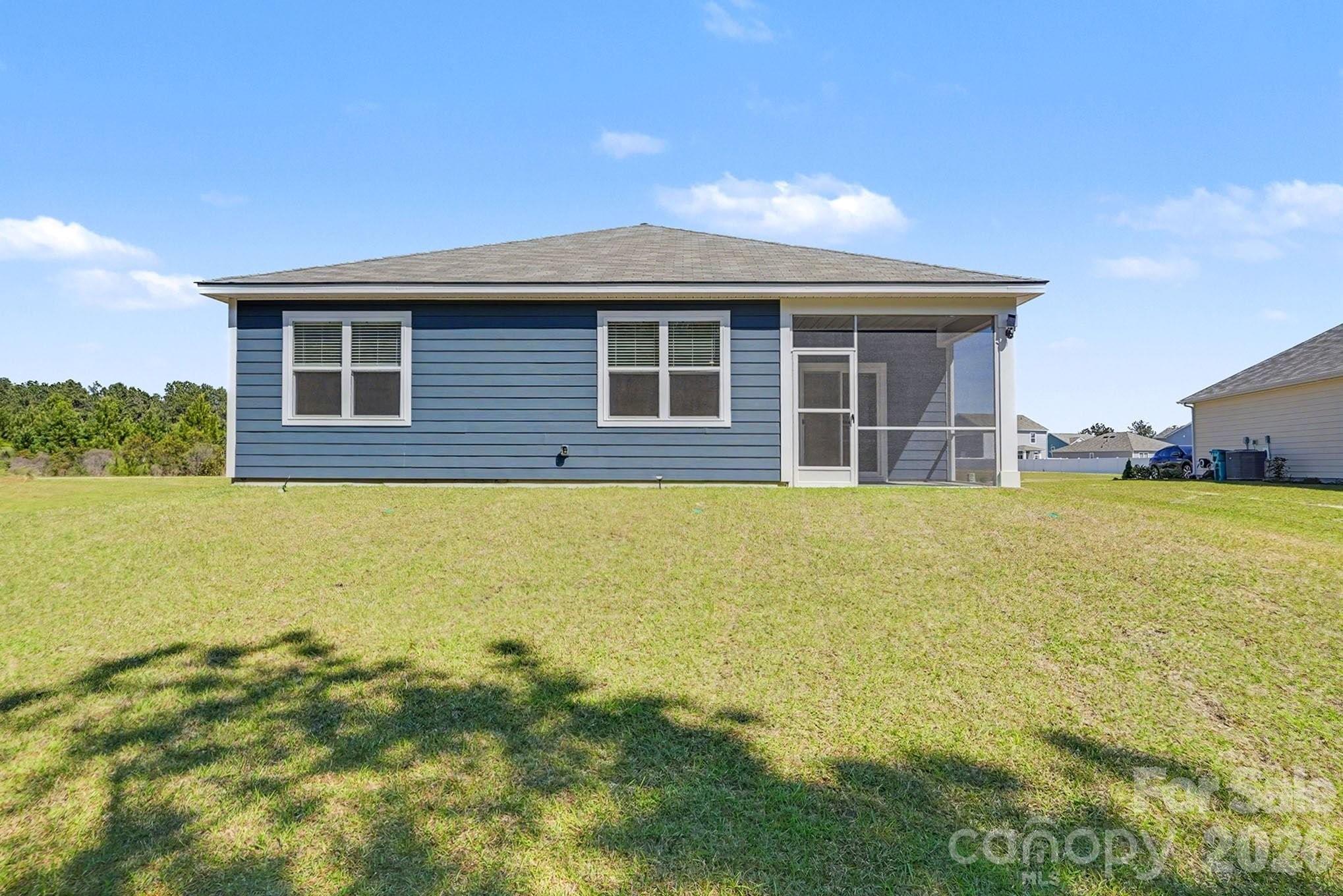 8093 Bear Claw Way Conway, SC 29526 - Photo 27 of 29 a front view of house with yard and lake view