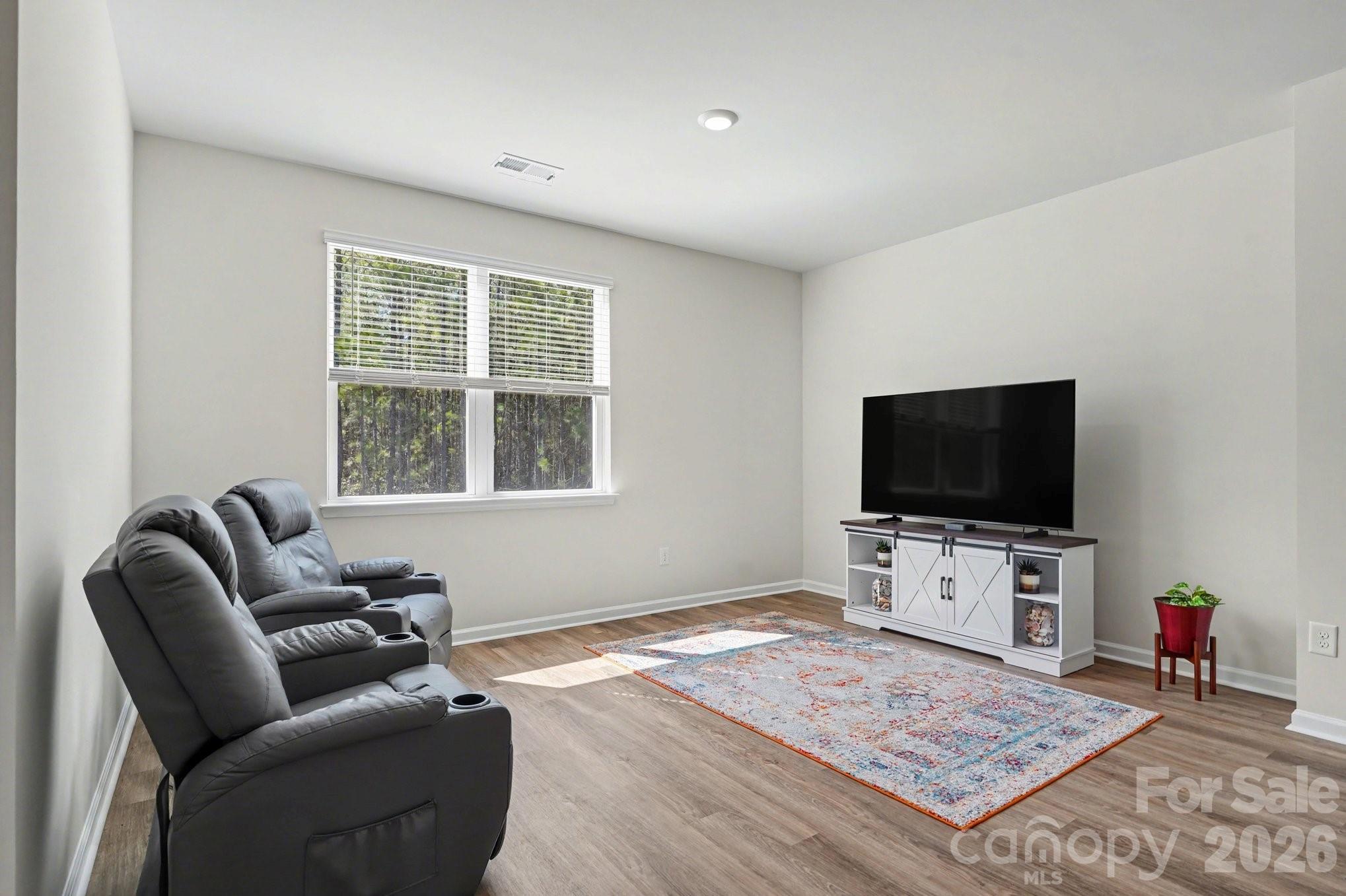 8093 Bear Claw Way Conway, SC 29526 - Photo 7 of 29 a living room with furniture and a flat screen tv