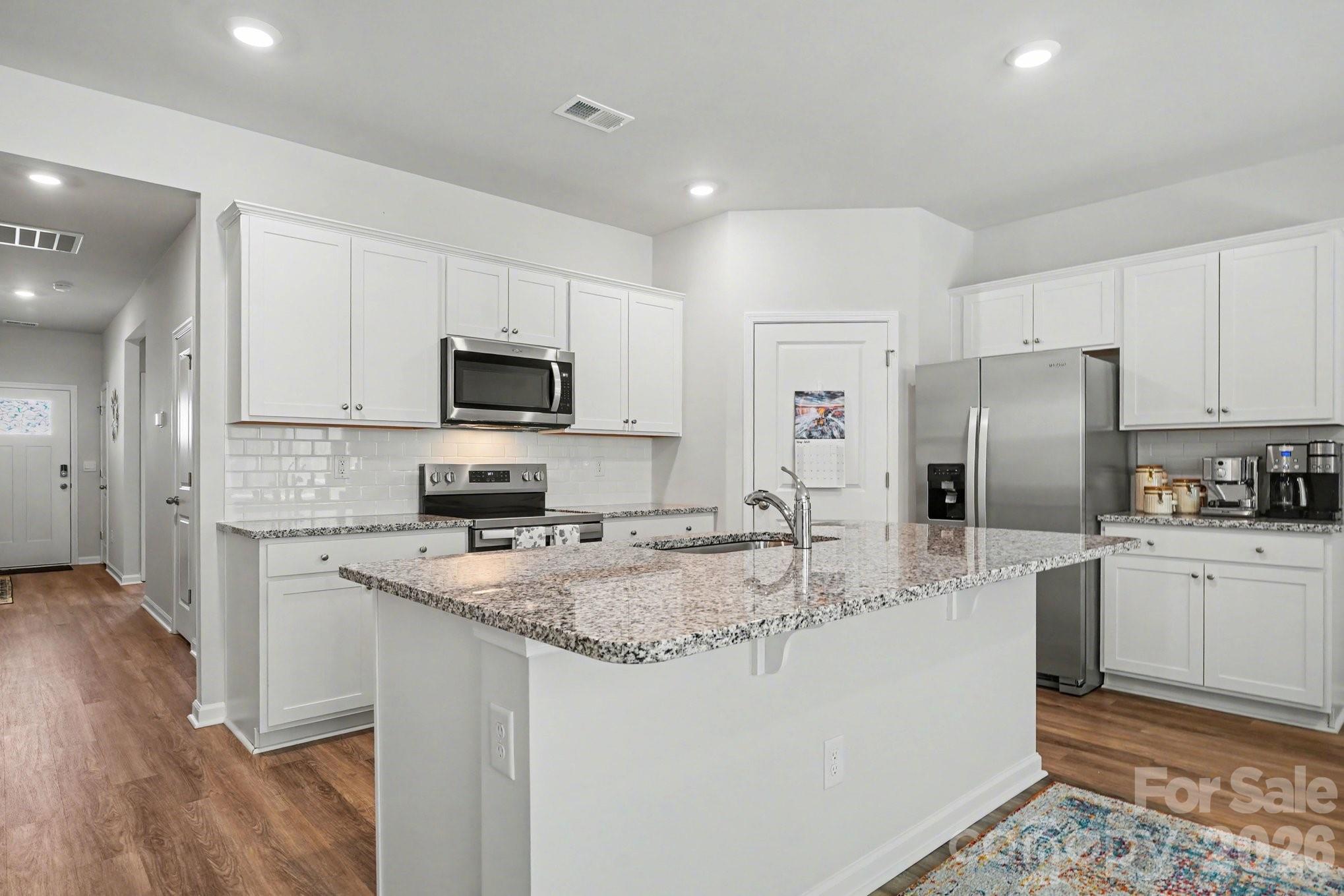 8093 Bear Claw Way Conway, SC 29526 - Photo 8 of 29 a kitchen with stainless steel appliances granite countertop a refrigerator stove microwave and sink