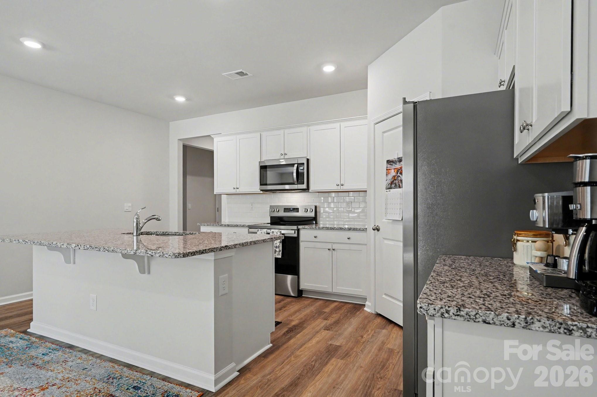 8093 Bear Claw Way Conway, SC 29526 - Photo 9 of 29 a kitchen with stainless steel appliances granite countertop a refrigerator sink and stove