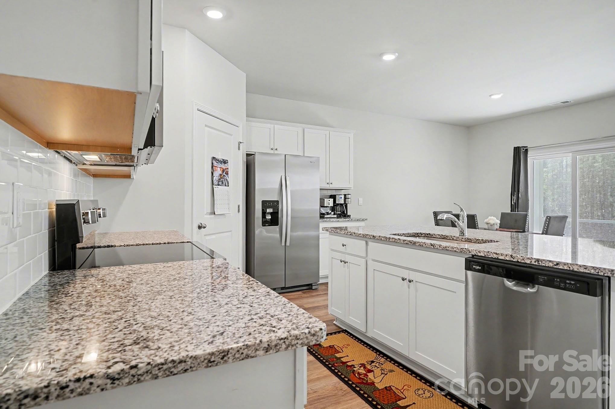 8093 Bear Claw Way Conway, SC 29526 - Photo 10 of 29 a kitchen with stainless steel appliances granite countertop a sink stove and refrigerator