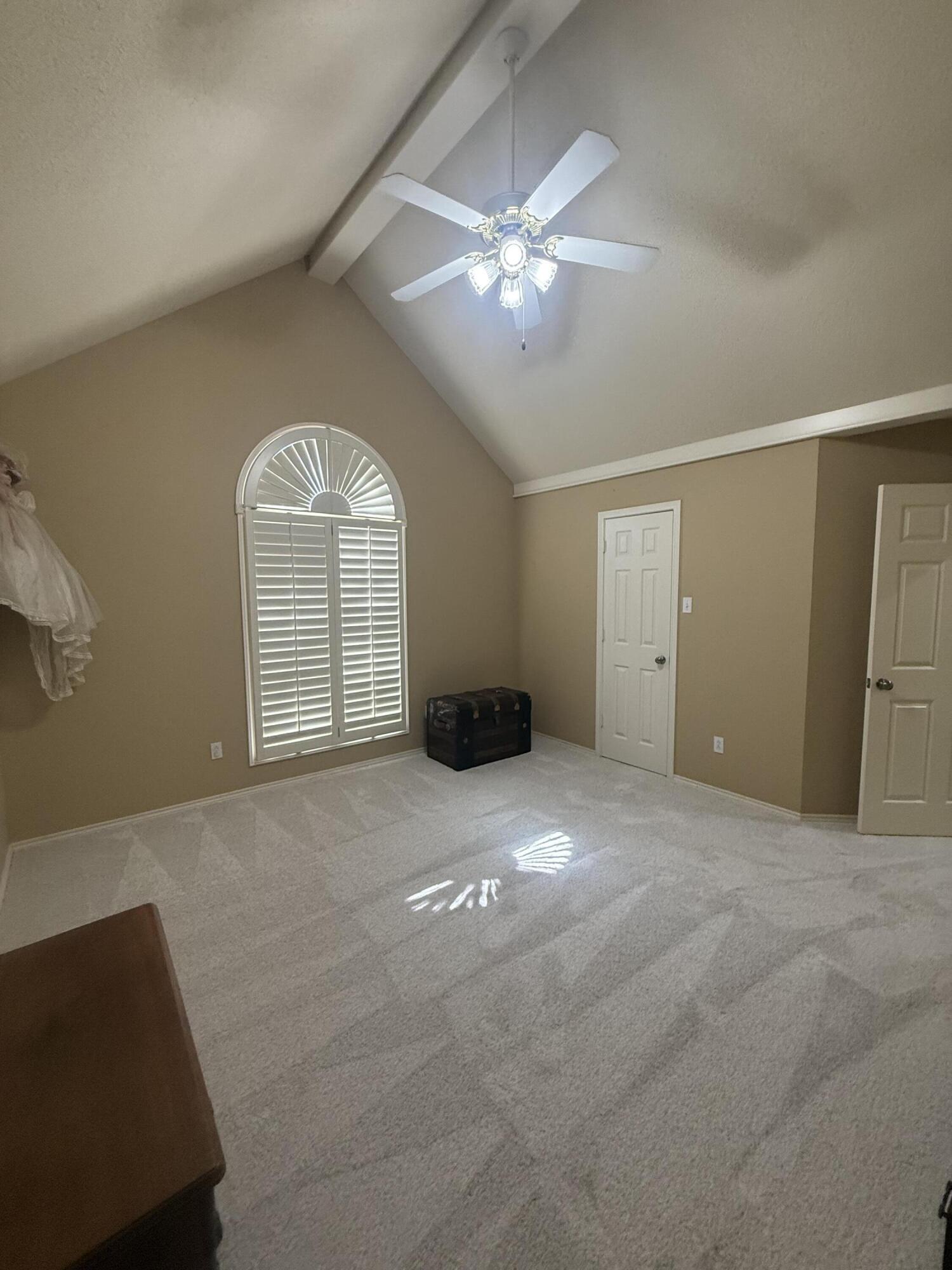 4810 99th Street Lubbock, TX 79424 - Photo 37 of 48 a view of an empty room with a chandelier fan