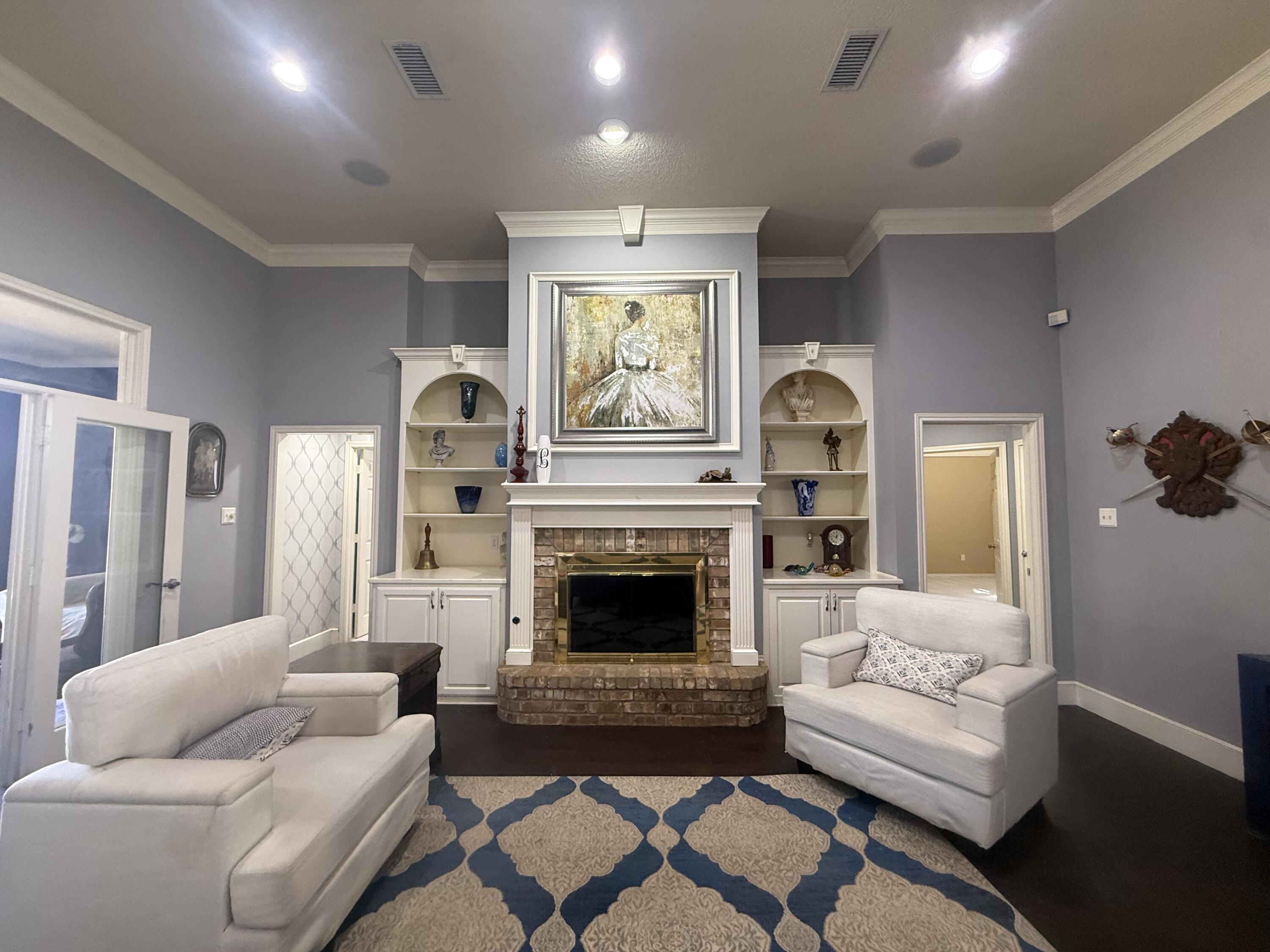 4810 99th Street Lubbock, TX 79424 - Photo 4 of 48 a living room with furniture fireplace and window