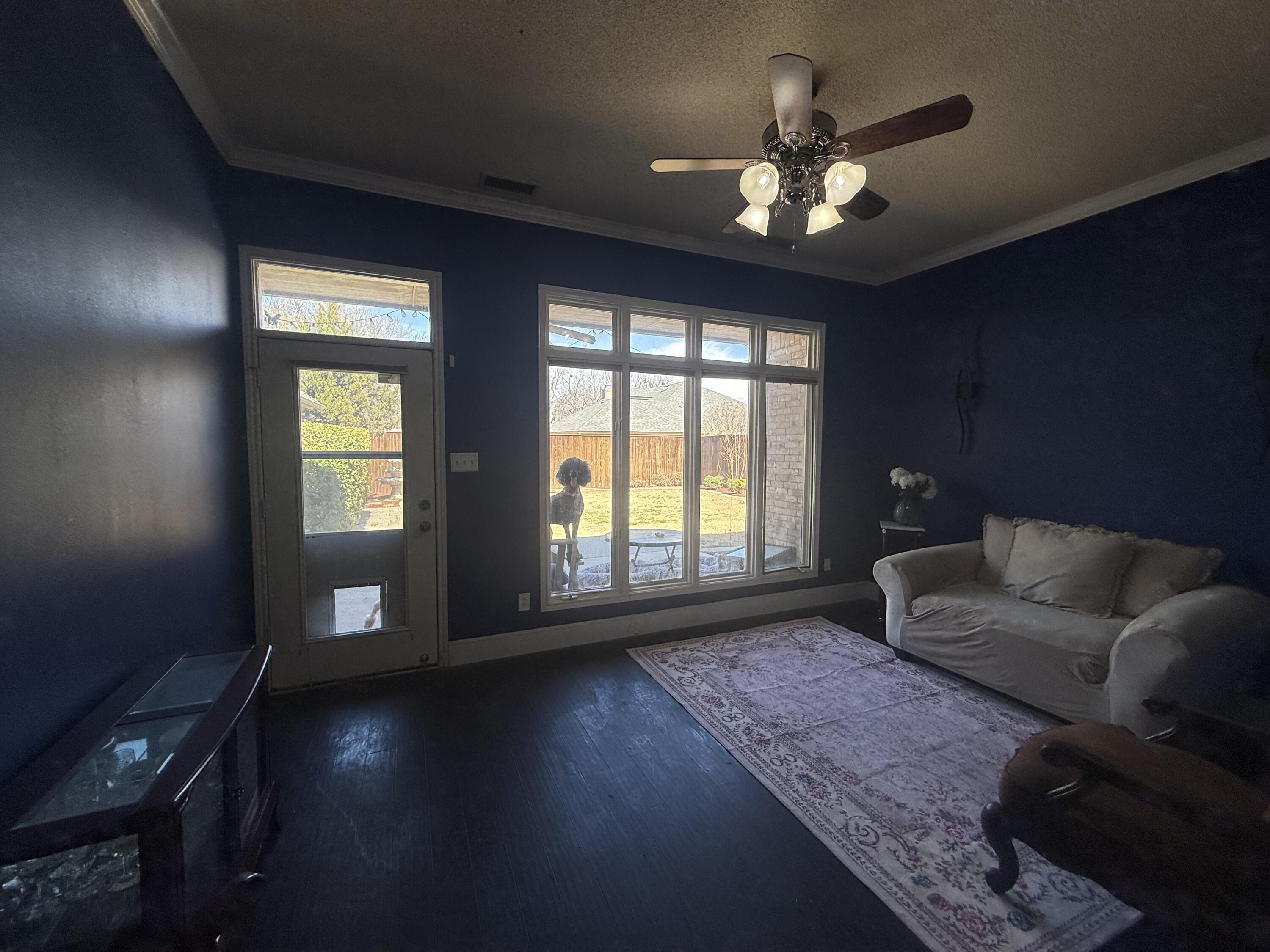 4810 99th Street Lubbock, TX 79424 - Photo 41 of 48 a living room with furniture and a large window