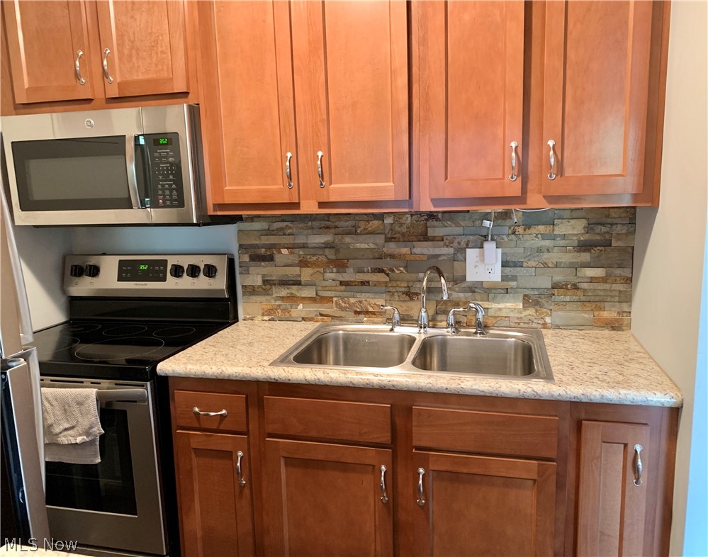 Cherry Cabinets & backsplash in the kitchen