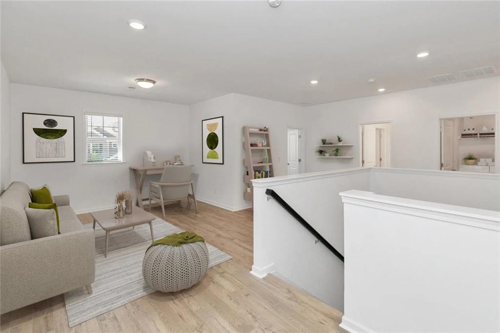 2159 Derrick Drive Grayson, GA 30017 - Photo 5 of 8 a living room with furniture and wooden floor
