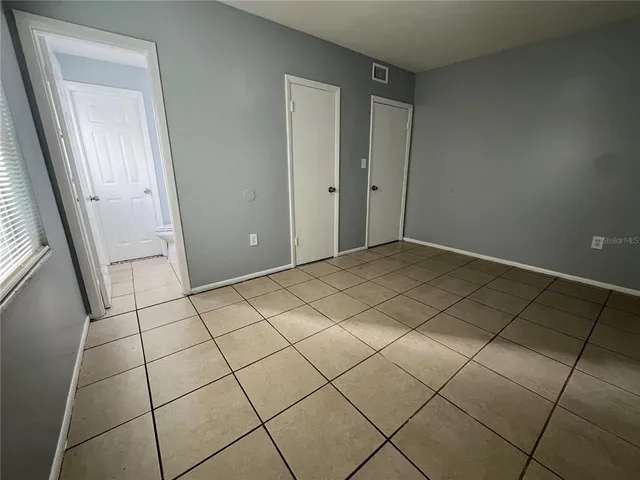 a view of a utility room and empty room