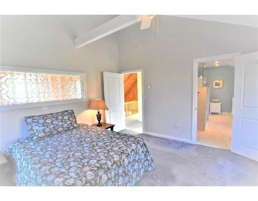 3 Highview Road Rockport, MA 01966 - Photo 23 of 41 a bedroom with a large bed and a window