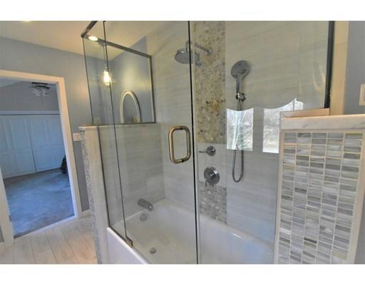 3 Highview Road Rockport, MA 01966 - Photo 26 of 41 a bathroom with a glass shower door