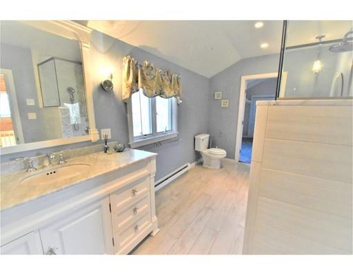 3 Highview Road Rockport, MA 01966 - Photo 27 of 41 a spacious bathroom with a granite countertop sink a toilet a mirror and shower