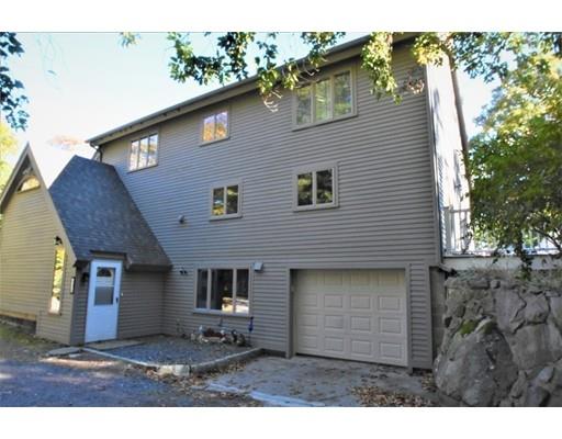 3 Highview Road Rockport, MA 01966 - Photo 7 of 41 a front view of a house with a garden