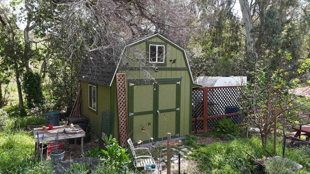 9237 Harmony Grove Road Escondido, CA 92029 - Photo 19 of 56 a front view of a house with a garden