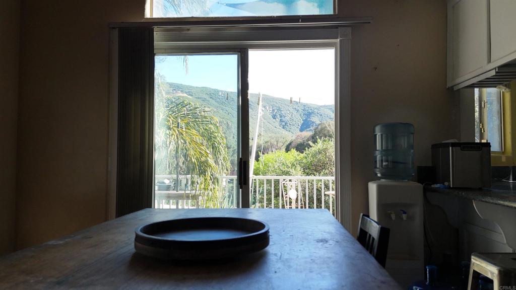 9237 Harmony Grove Road Escondido, CA 92029 - Photo 29 of 56 a living room with a large window and floor to ceiling window