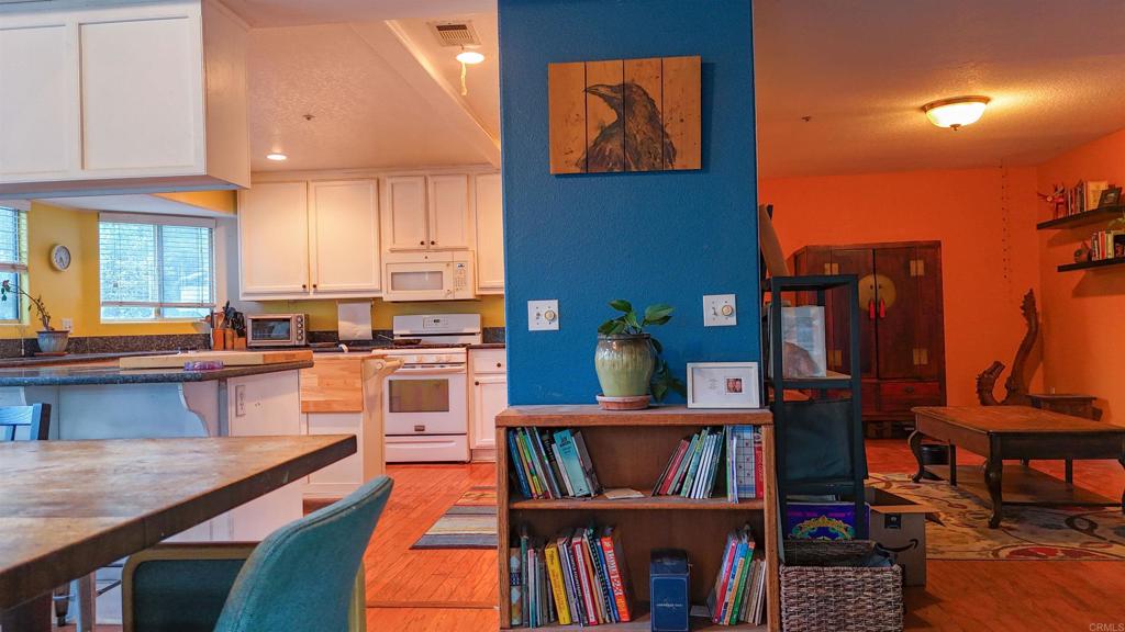 9237 Harmony Grove Road Escondido, CA 92029 - Photo 30 of 56 a open kitchen with stainless steel appliances granite countertop a stove and a refrigerator