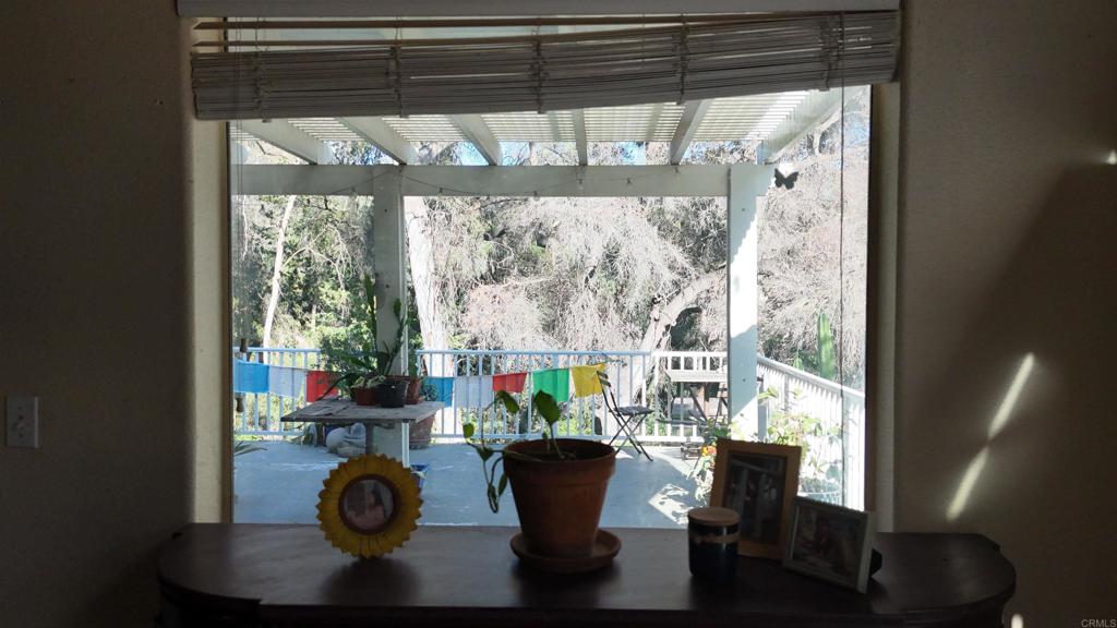 9237 Harmony Grove Road Escondido, CA 92029 - Photo 31 of 56 a dining room with furniture and a window