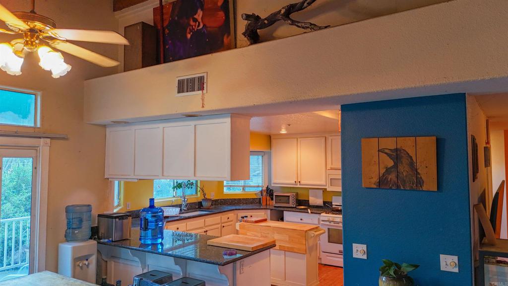 9237 Harmony Grove Road Escondido, CA 92029 - Photo 32 of 56 a living room with furniture and a large window