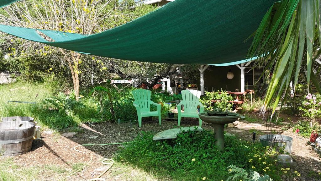 9237 Harmony Grove Road Escondido, CA 92029 - Photo 36 of 56 a backyard of a house with lots of green space and outdoor seating