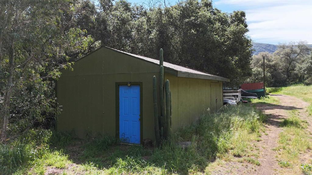 9237 Harmony Grove Road Escondido, CA 92029 - Photo 40 of 56 a backyard of a house with lots of green space
