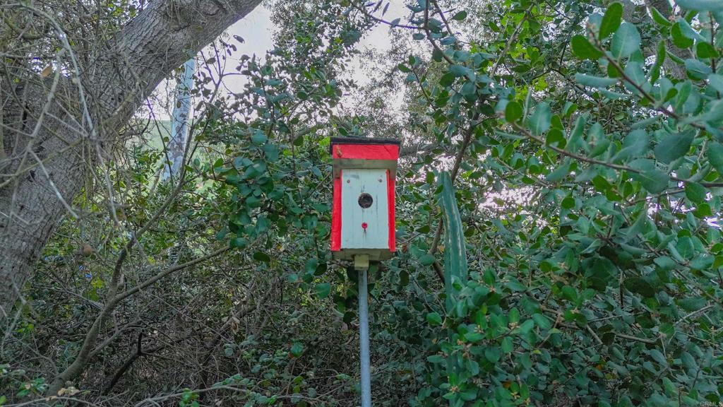 9237 Harmony Grove Road Escondido, CA 92029 - Photo 51 of 56 a sign that is on the side of a tree