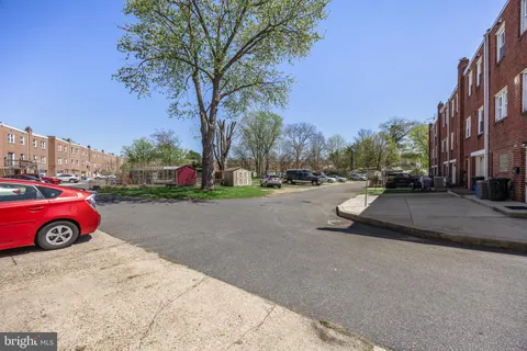 a view of street with parked cars