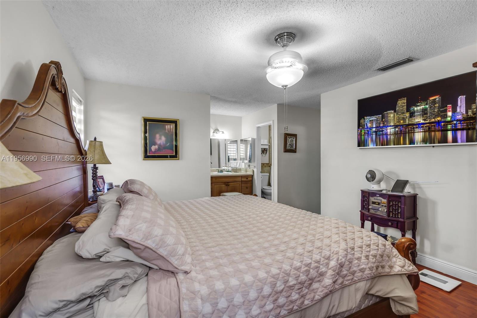 9466 Southwest 6th Lane Miami, FL 33174 - Photo 16 of 34 a bedroom with a bed and a chandelier