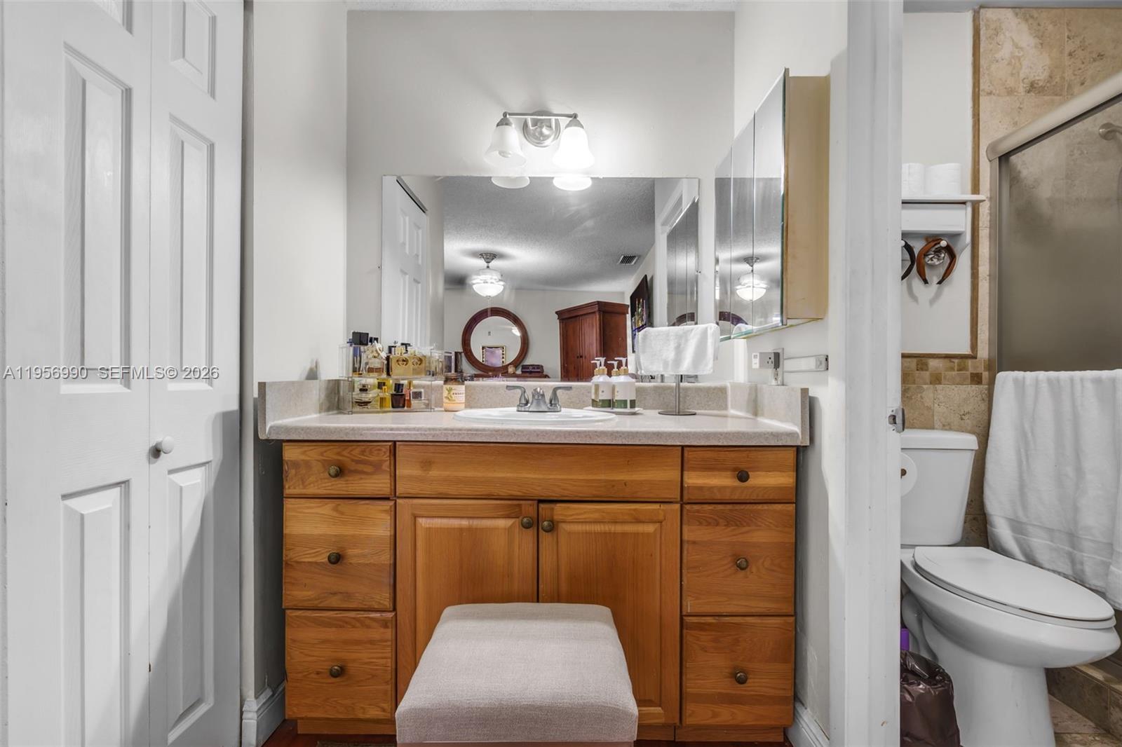 9466 Southwest 6th Lane Miami, FL 33174 - Photo 17 of 34 a bathroom with a sink toilet and shower