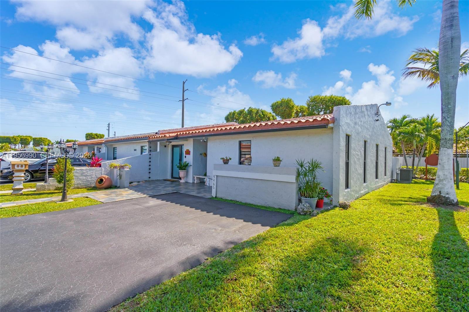 9466 Southwest 6th Lane Miami, FL 33174 - Photo 2 of 34 a view of a house with a yard and sitting area
