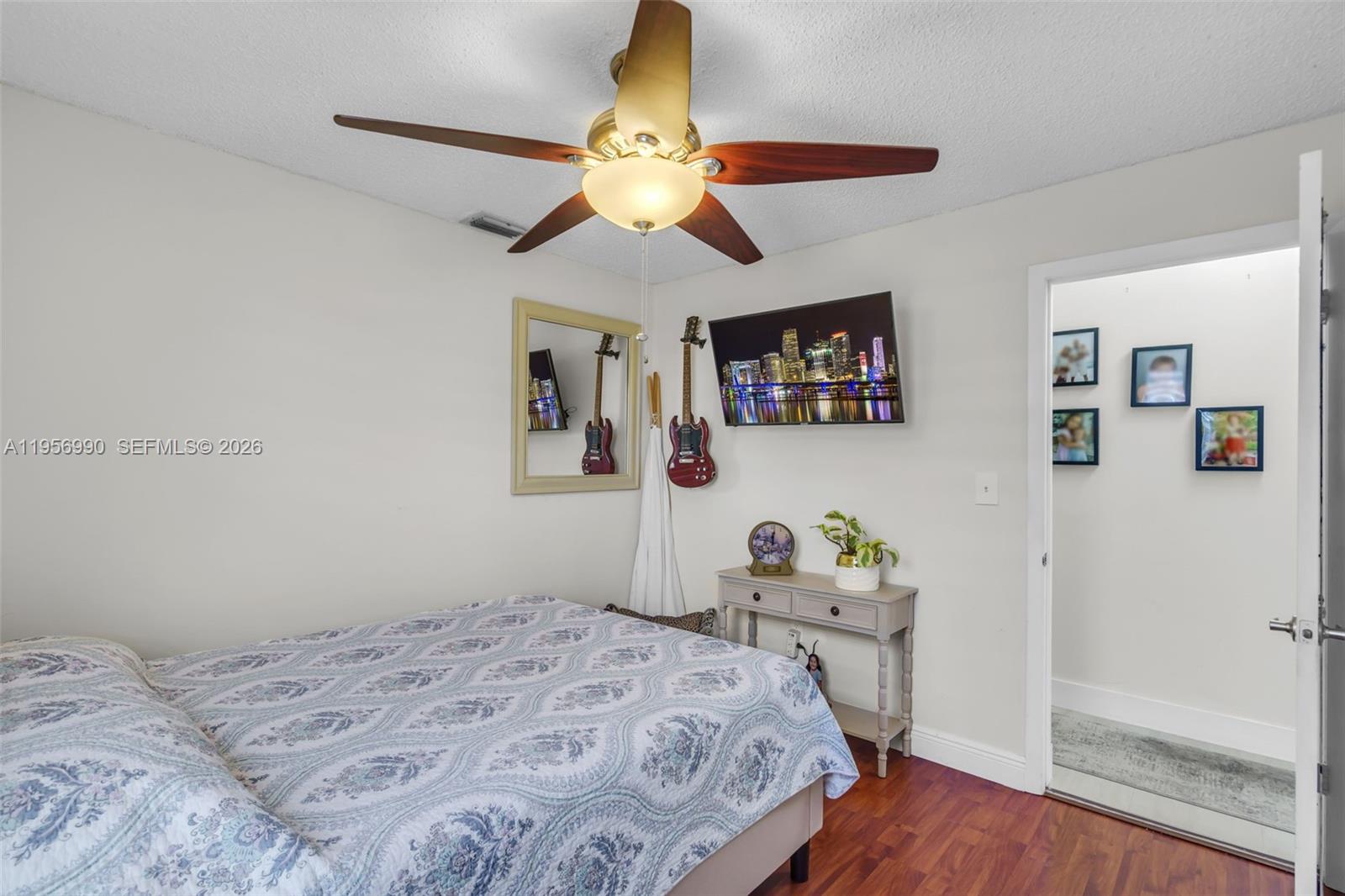 9466 Southwest 6th Lane Miami, FL 33174 - Photo 21 of 34 a bedroom with a bed and a chandelier