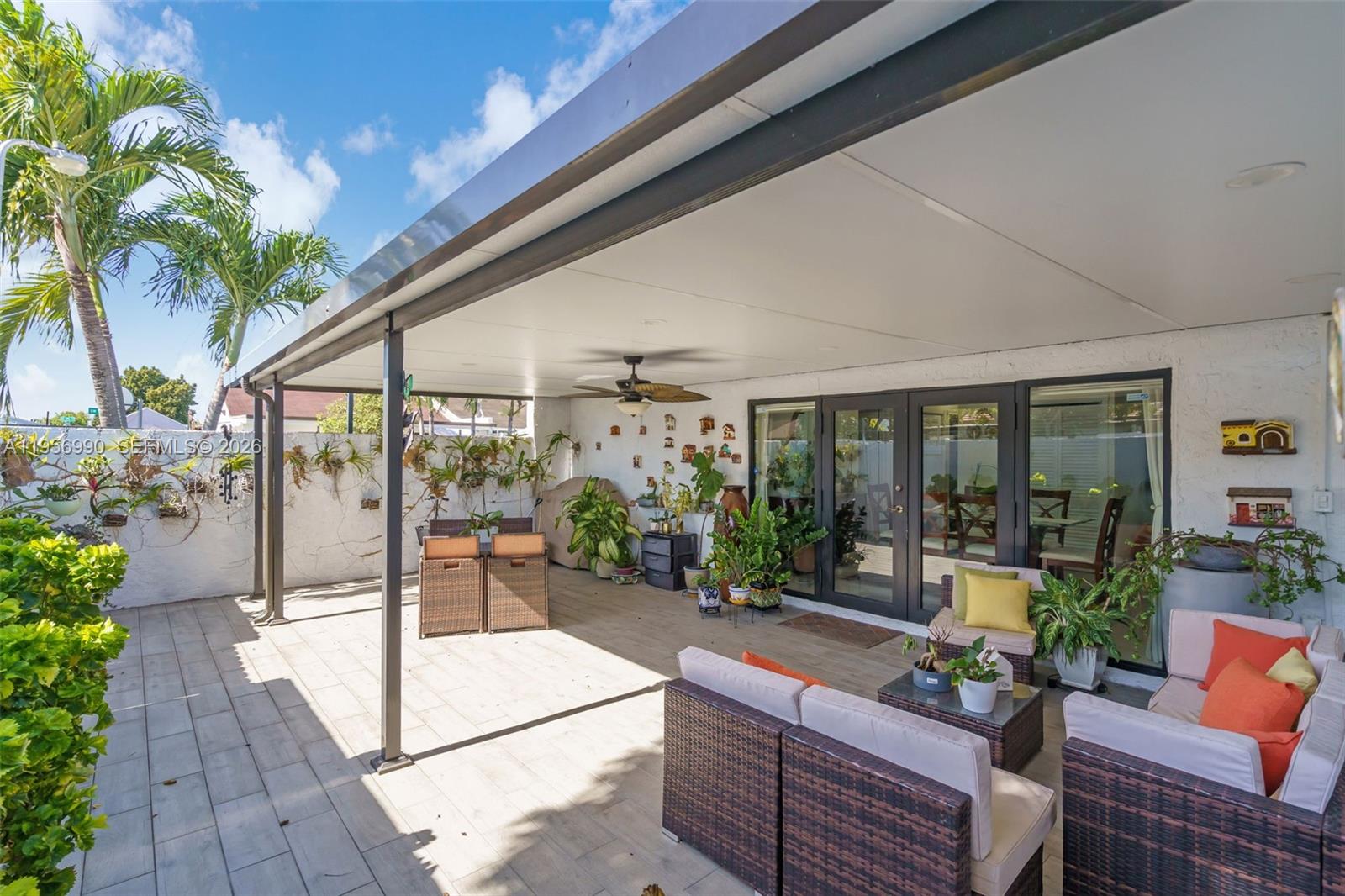 9466 Southwest 6th Lane Miami, FL 33174 - Photo 24 of 34 a building outdoor space with patio furniture and potted plants