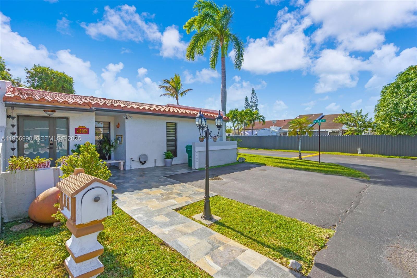 9466 Southwest 6th Lane Miami, FL 33174 - Photo 3 of 34 a house view with a sitting space fire pit and outdoor space