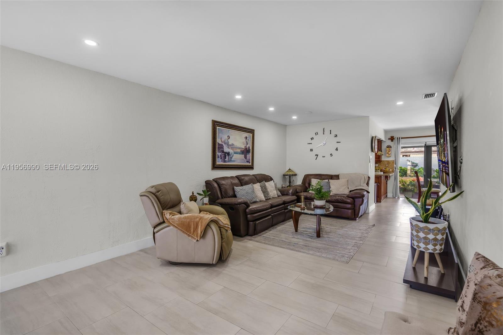 9466 Southwest 6th Lane Miami, FL 33174 - Photo 5 of 34 a living room with furniture and a flat screen tv